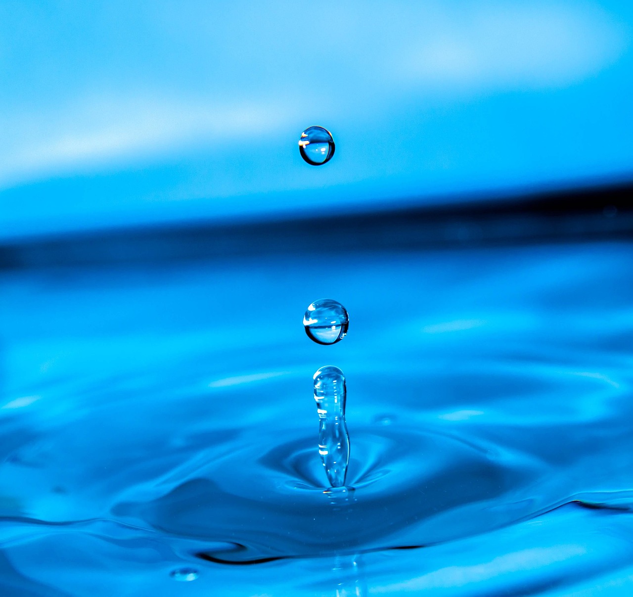 clear water with 2 drops floating